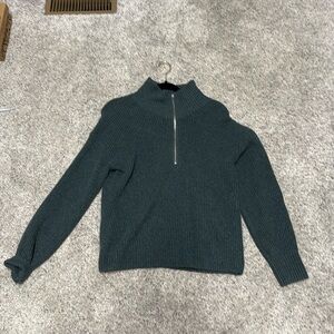 Women’s quarter zip sweater.